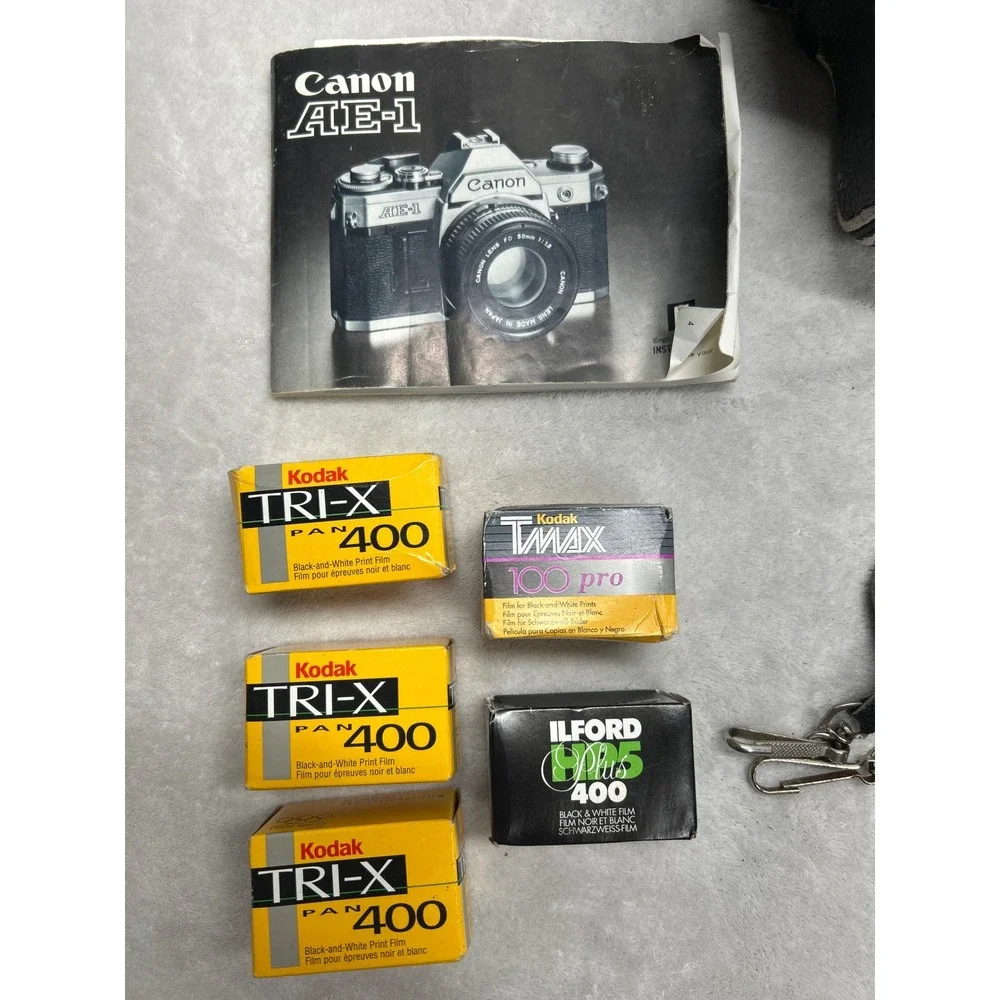 Canon AE-1 Film Camera SLR 35mm 50mm Lens Flash Case Manual Film Lot Untested